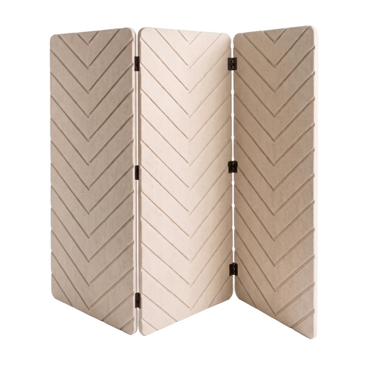 A three-panel folding screen with a textured chevron pattern in warm beige and cream tones, connected by black metal hinges, set against a clean white background.