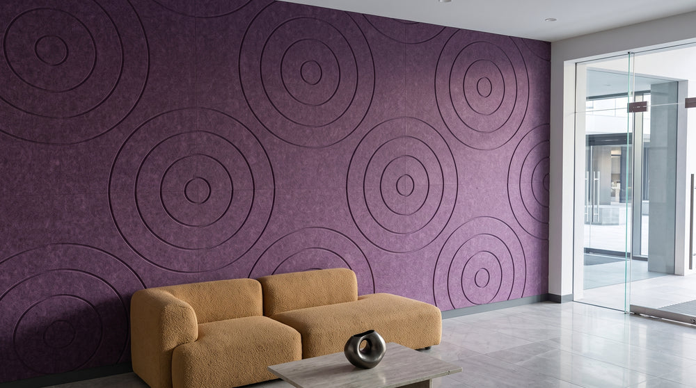 Orbit engraved felt wall panels in Purple, in a reception area
