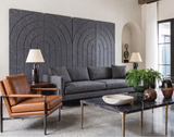 Slate grey arches engraved folding room divider opened out flat against a wall as a decorative feature
