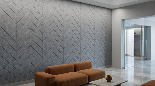 Chevron engraved felt wall panels in Ash Grey, in a reception area