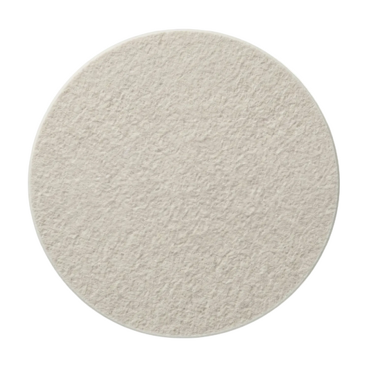 A round, pet felt tile in natural cotton