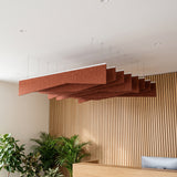 Crease felt ceiling baffles in Cinnamon over a reception desk with a slatted timber wall