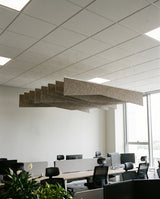 Crease felt ceiling baffles in Silk over an open-plan office