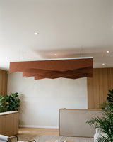 Crimp felt ceiling baffles in Cinnamon over a reception area