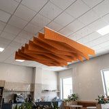 Crimp felt ceiling baffles in Orange over a café