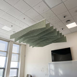 Crimp felt ceiling baffles in Tea Green in a meeting room