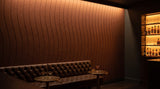 Drift engraved felt wall panels in Cinnamon, behind a bar
