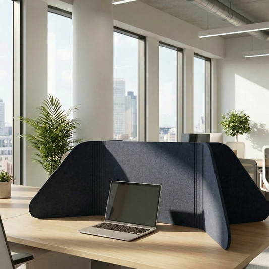 Laptop on a desk with a black privacy screen in an office setting