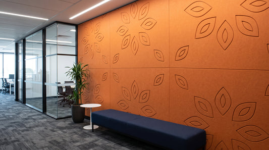 Lotus engraved felt wall panels in Orange, in an office