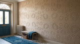Pebble Beach engraved felt wall panels in Wheat, along a hallway