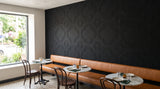 Quatrefoil engraved felt wall panels in Black, in a restaurant