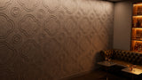 Quatrefoil engraved felt wall panels in Doe, behind a bar