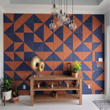 Navy and terracotta right angle triangle acoustic PET felt feature wall in a modern room