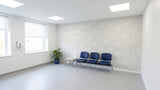 Rainbow engraved felt wall panels in White, in a clinic waiting area