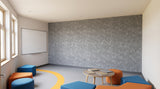 Rainfall engraved felt wall panels in Dark Silver, in a school space