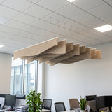 Ruche felt ceiling baffles in Wheat over open-plan office desks