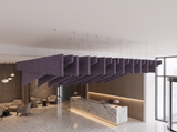A run of deep purple Felted trapezoid acoustic baffles with raked staggered blades hung on wires above a reception lobby, with a marble desk, lounge armchairs and a terrazzo floor.
