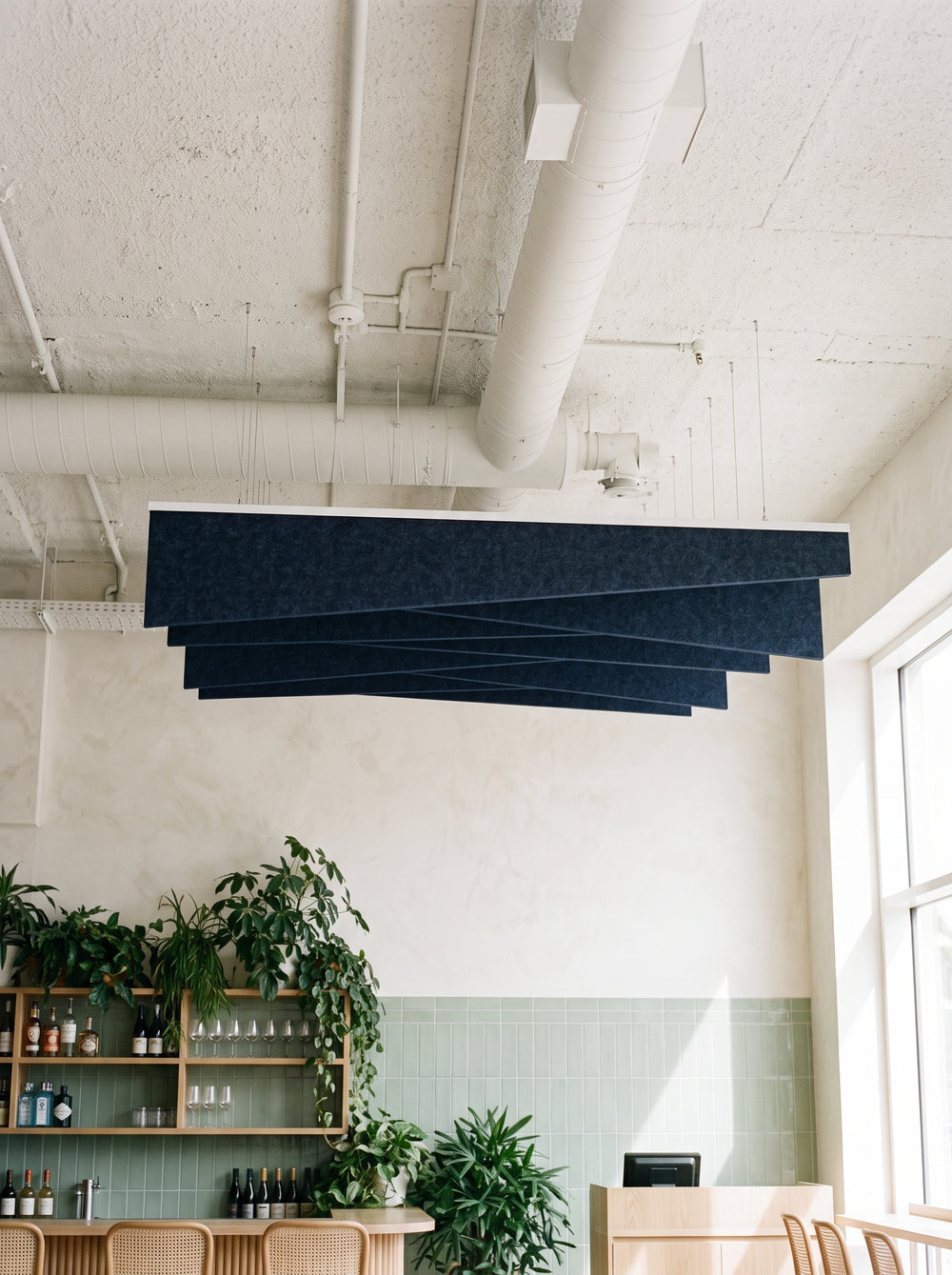 Twill felt ceiling baffles in Midnight Blue over a café counter