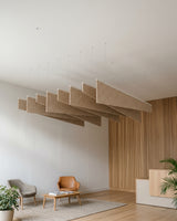 Twill felt ceiling baffles in Wheat in a lounge with a slatted timber wall
