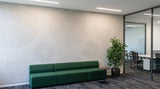 Vortex engraved felt wall panels in Natural Cotton, in an office